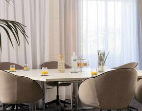 Meeting room with square table at the Hilton Garden Inn Tours Centre.