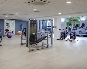 Well equipped fitness center at Hilton London Watford.