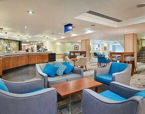 Comfortable lounge and coworking space at Hilton London Watford.
