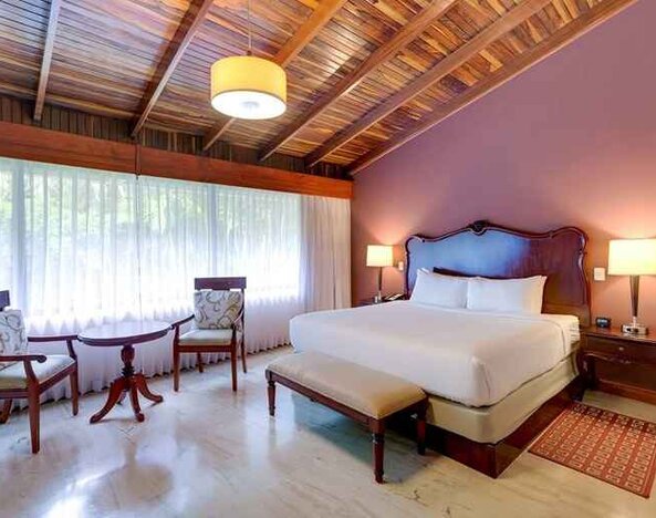 spacious king suite with dining area at DoubleTree by Hilton Hotel Cariari San Jose - Costa Rica.