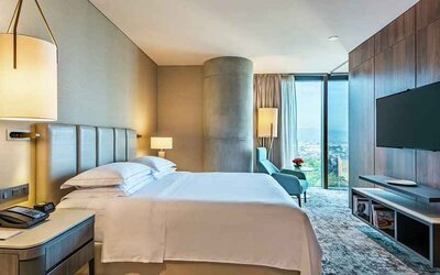 spacious king room with TV and lots of natural light at Hilton Bogota Corferias.