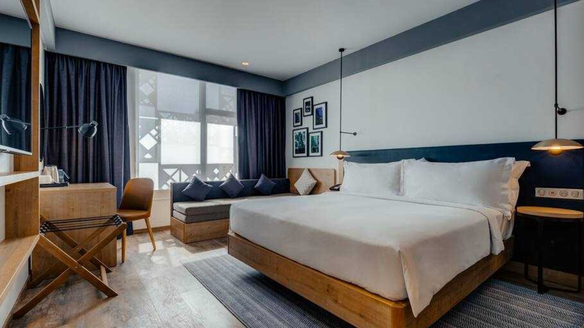 King guestroom with sofa and desk at the Hilton Garden inn Casablanca Sud.