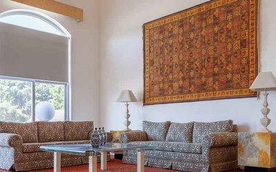 Stylish living room in a presidential suite at the MM Grand Hotel Puebla, Tapestry Collection by Hilton.