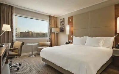 spacious king room with TV and work desk at Hilton Barcelona.