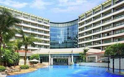 stunning outdoor pool with sunbeds at Hilton Guangzhou Science City.