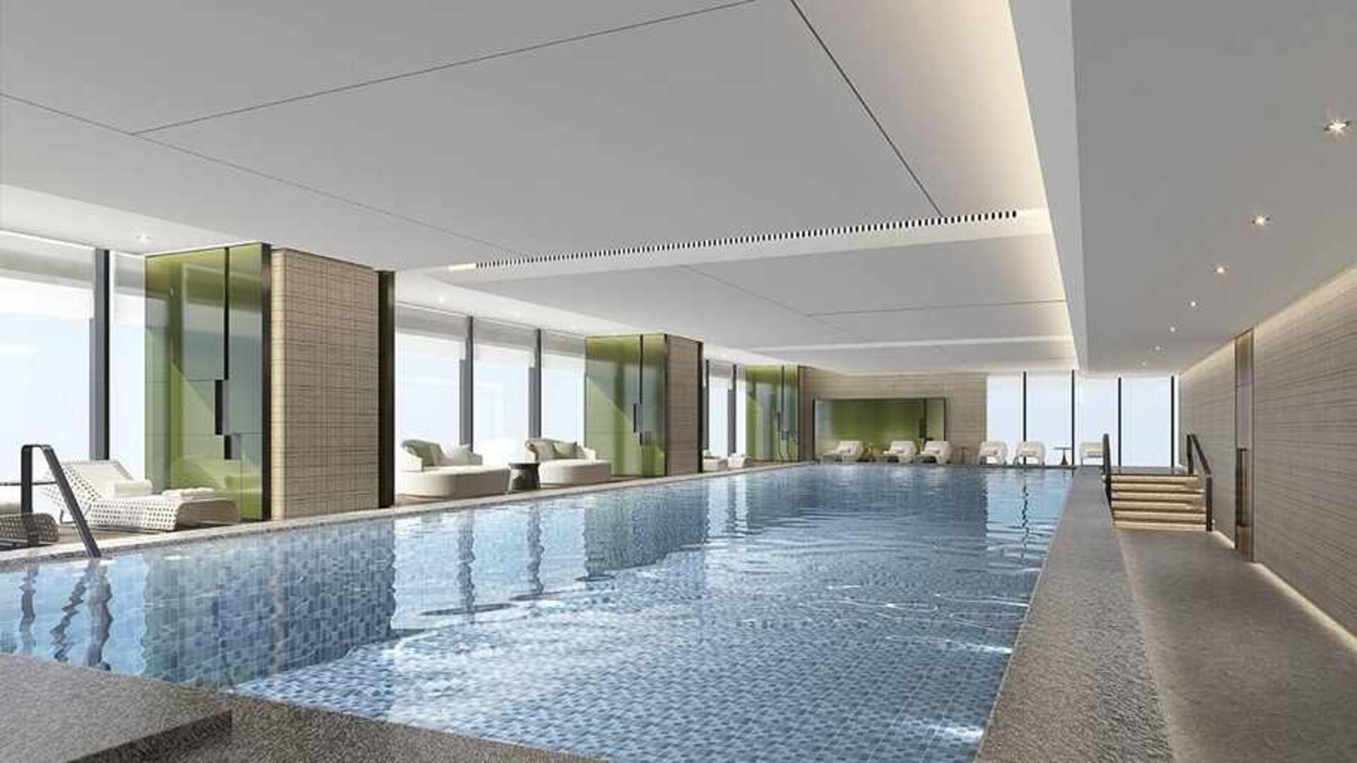 beautiful indoor pool large enough to do laps, surrounded by sun beds at DoubleTree by Hilton Kunming Airport.