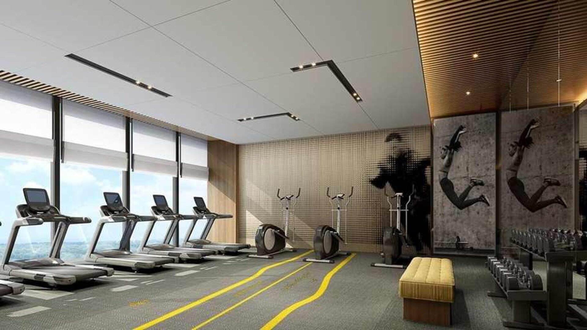 well equipped fitness center with lots of natural light at DoubleTree by Hilton Kunming Airport.