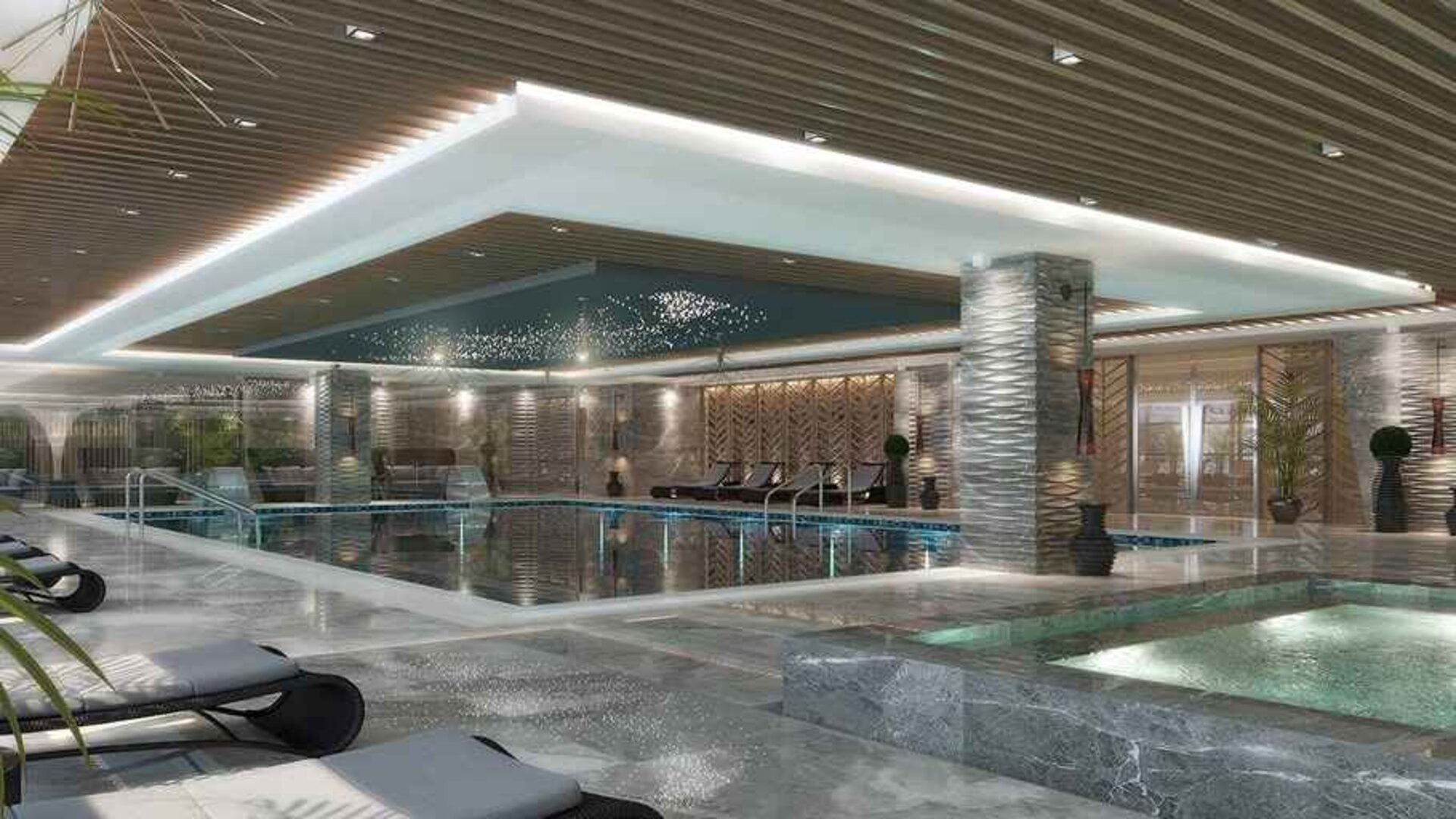 luxurious indoor pool surrounded by sunbeds at DoubleTree by Hilton Manisa.