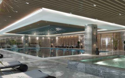 luxurious indoor pool surrounded by sunbeds at DoubleTree by Hilton Manisa.