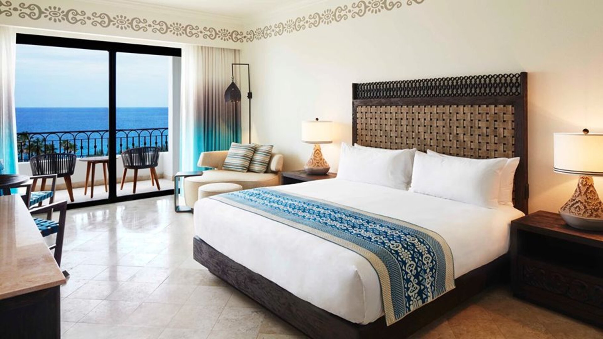 King bedroom with working station overlooking the ocean at the Hilton Los Cabos Beach & Golf Resort.