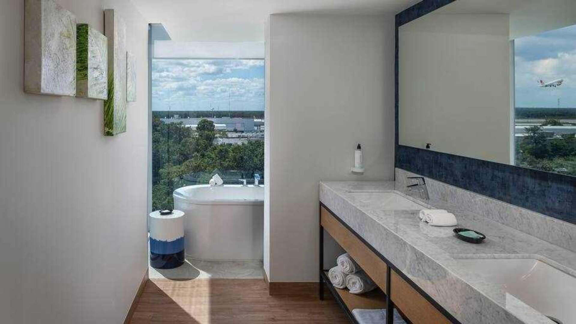 Bathroom with bath tub overlooking the airport at the Hilton Garden Inn Cancun Airport.