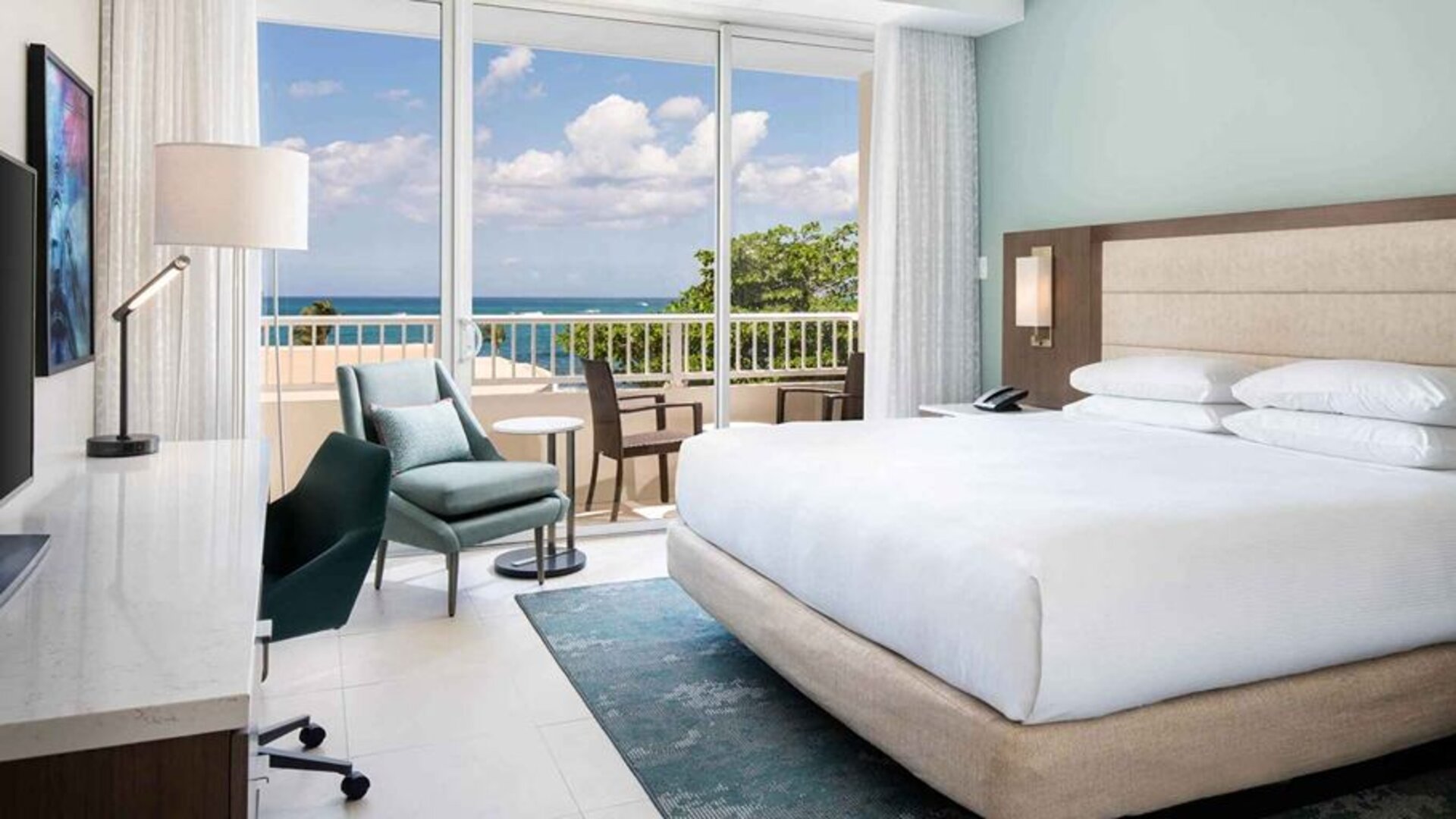 King bedroom with desk at the Caribe Hilton.