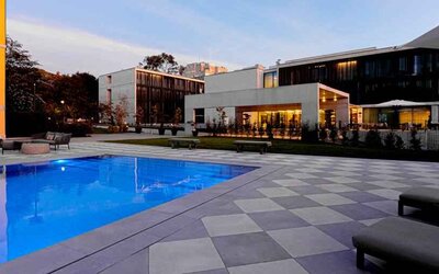 Relaxing outdoor pool at the Boeira Garden Hotel Porto Gaia, Curio Collection by Hilton.