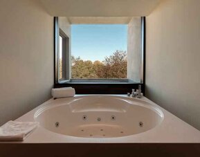Bath tub at the Boeira Garden Hotel Porto Gaia, Curio Collection by Hilton.