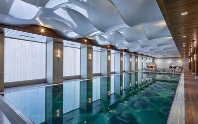 lovely indoor pool with seating area at DoubleTree by Hilton Istanbul Topkapi.