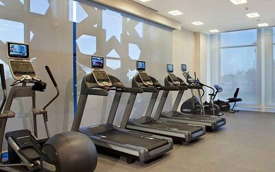 well equipped fitness center with treadmills, step machines, and weights at Hilton Garden Inn Konya, Turkey.