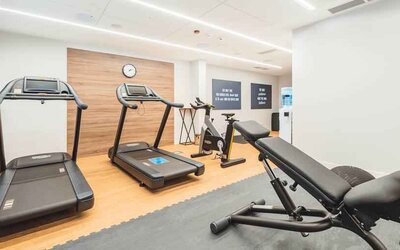 Fitness center with treadmills at the Hampton by Hilton Warsaw Reduta.