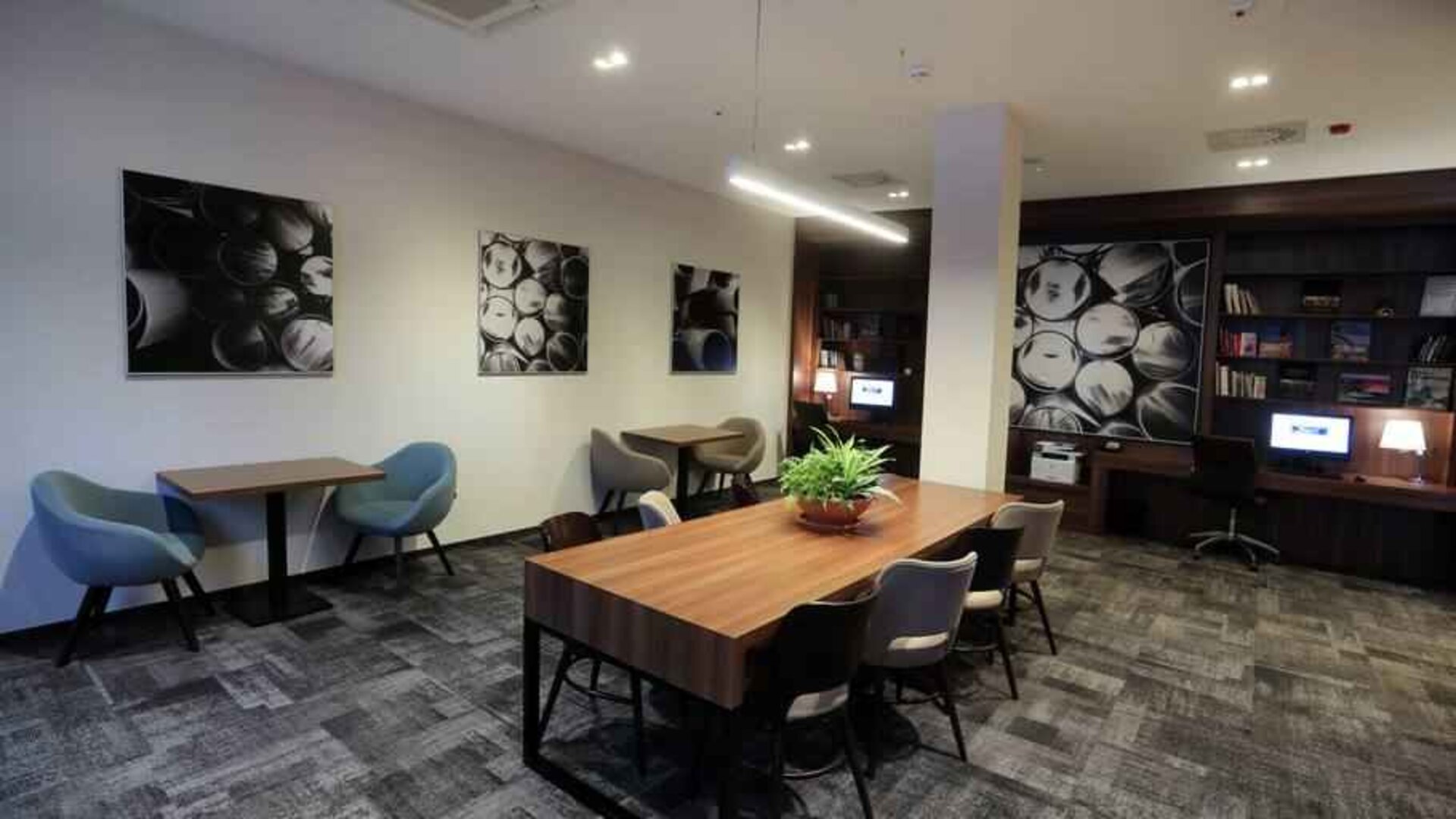 Hotel workspace with large table at the Hampton by Hilton Gdansk Old Town.