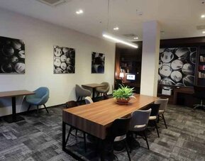 Hotel workspace with large table at the Hampton by Hilton Gdansk Old Town.