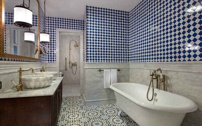 clean and spacious bathroom with bath and shower at Hagia Sofia Mansions Istanbul, Curio Collection by Hilton.