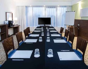 Meeting room with TV screen at the Hampton by Hilton Gdansk Oliwa.