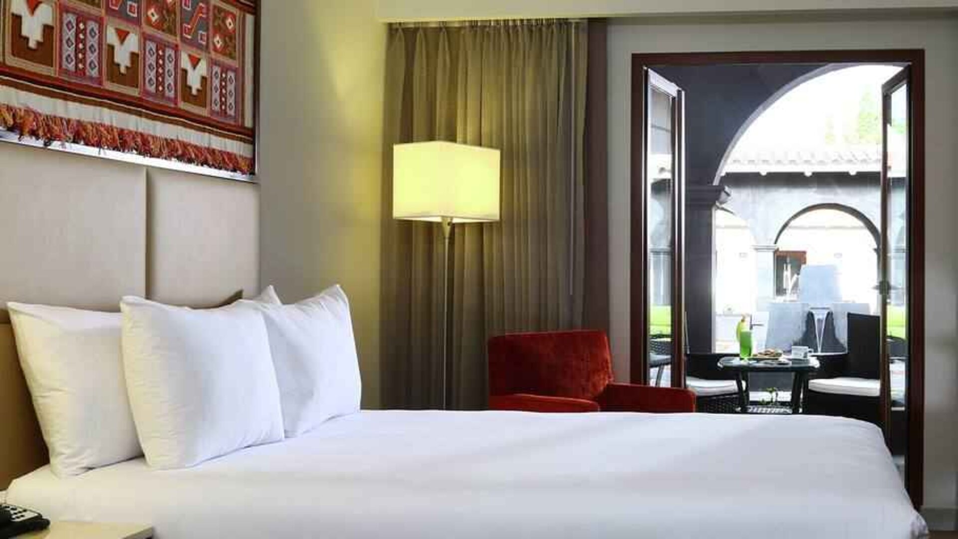 Queen room with working station overlooking the patio at the Hilton Garden Inn Cusco, Peru.