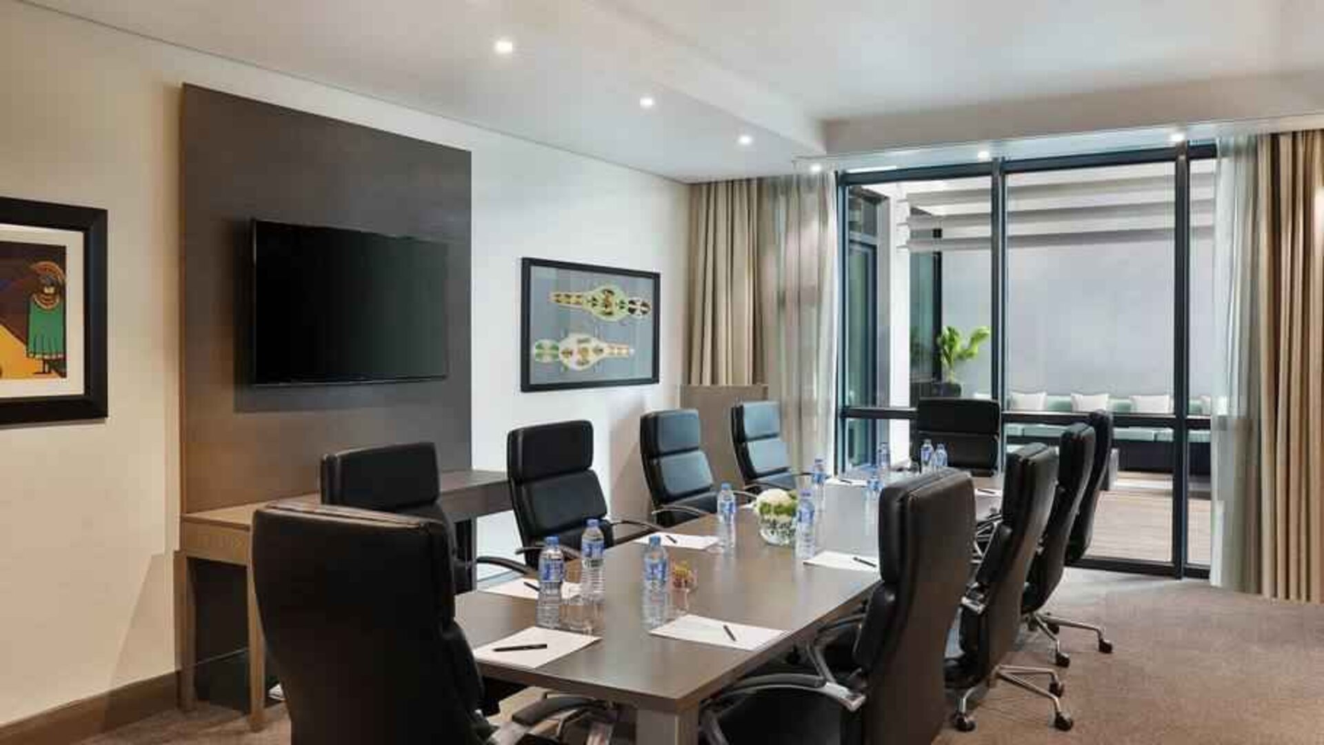 Meeting room with TV screen at the Legend Hotel Lagos Airport, Curio Collection by Hilton.