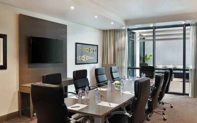 Meeting room with TV screen at the Legend Hotel Lagos Airport, Curio Collection by Hilton.