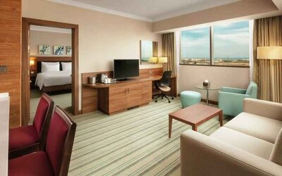 Living room with working station at the Hilton Garden Inn Al Jubail.