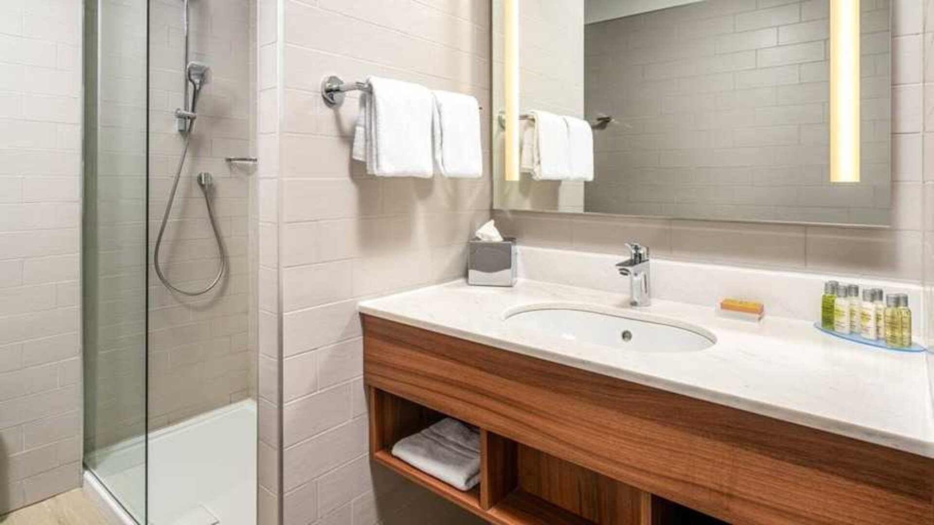 clean and spacious bathroom with shower at Hilton Garden Inn Bucharest Old Town.