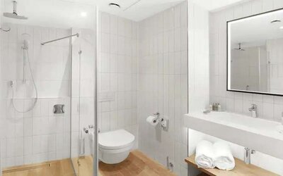 clean and spacious bathroom with shower at Hilton Garden Inn Bucharest Airport.