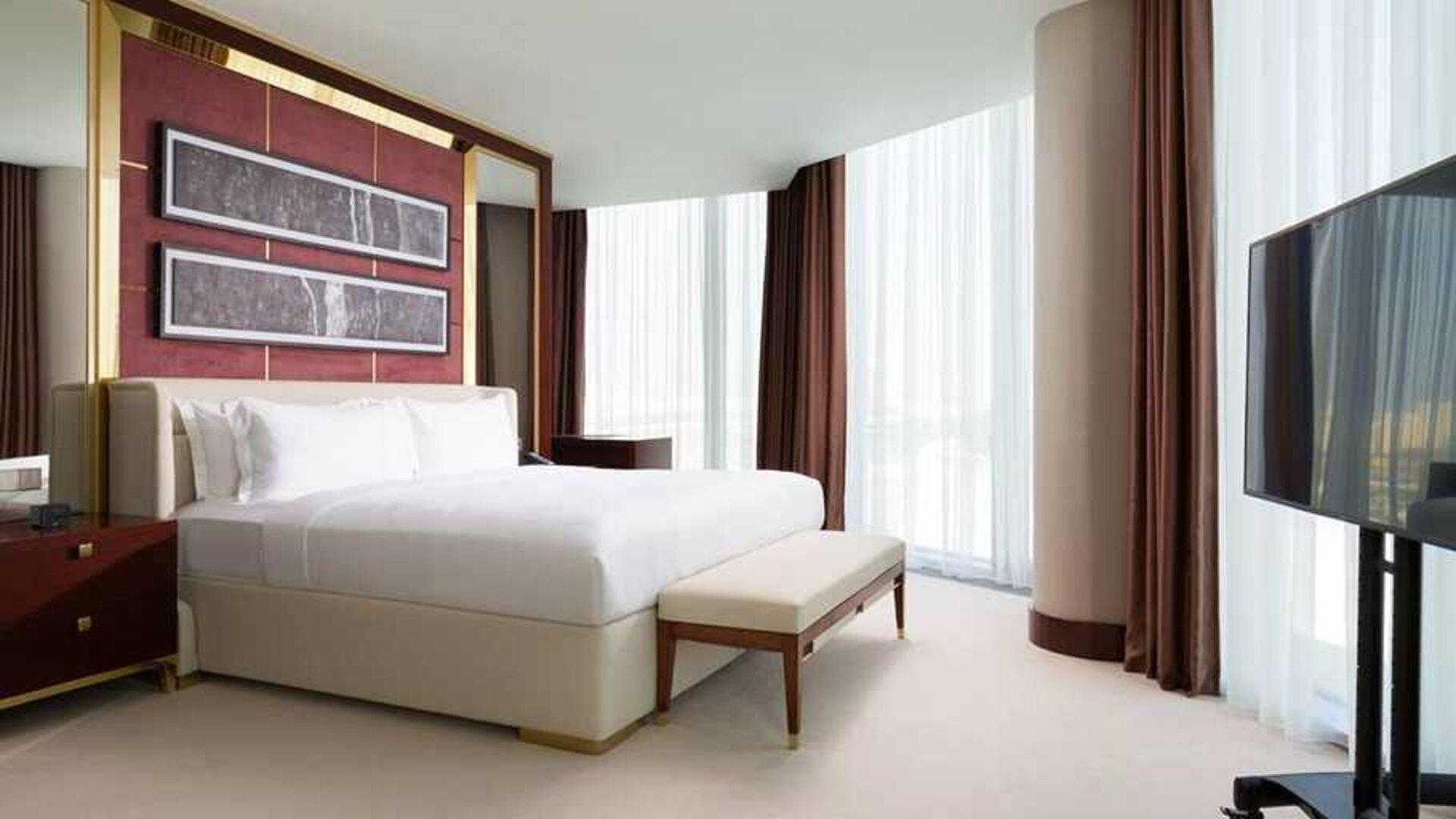 comfortable king room with TV and lots of natural light at Hilton Astana.