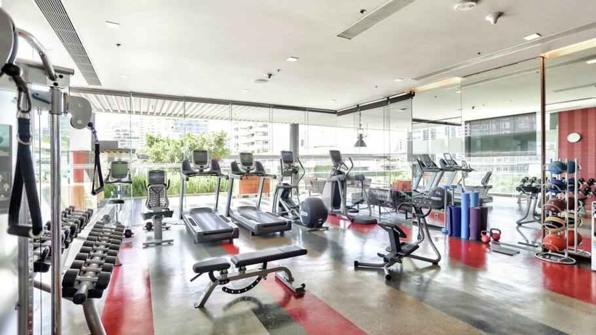 Fully equipped fitness center at the DoubleTree by Hilton Sukhumvit Bangkok.