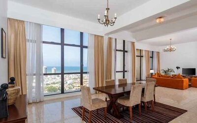 Living room with sofas, tables and chairs at the Hilton Colombo Residence.