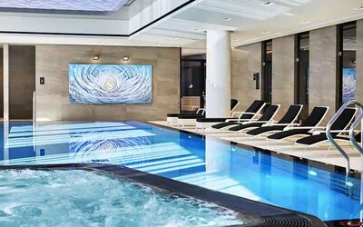 stunning indoor pool with sunbeds at Hilton Tallinn Park.
