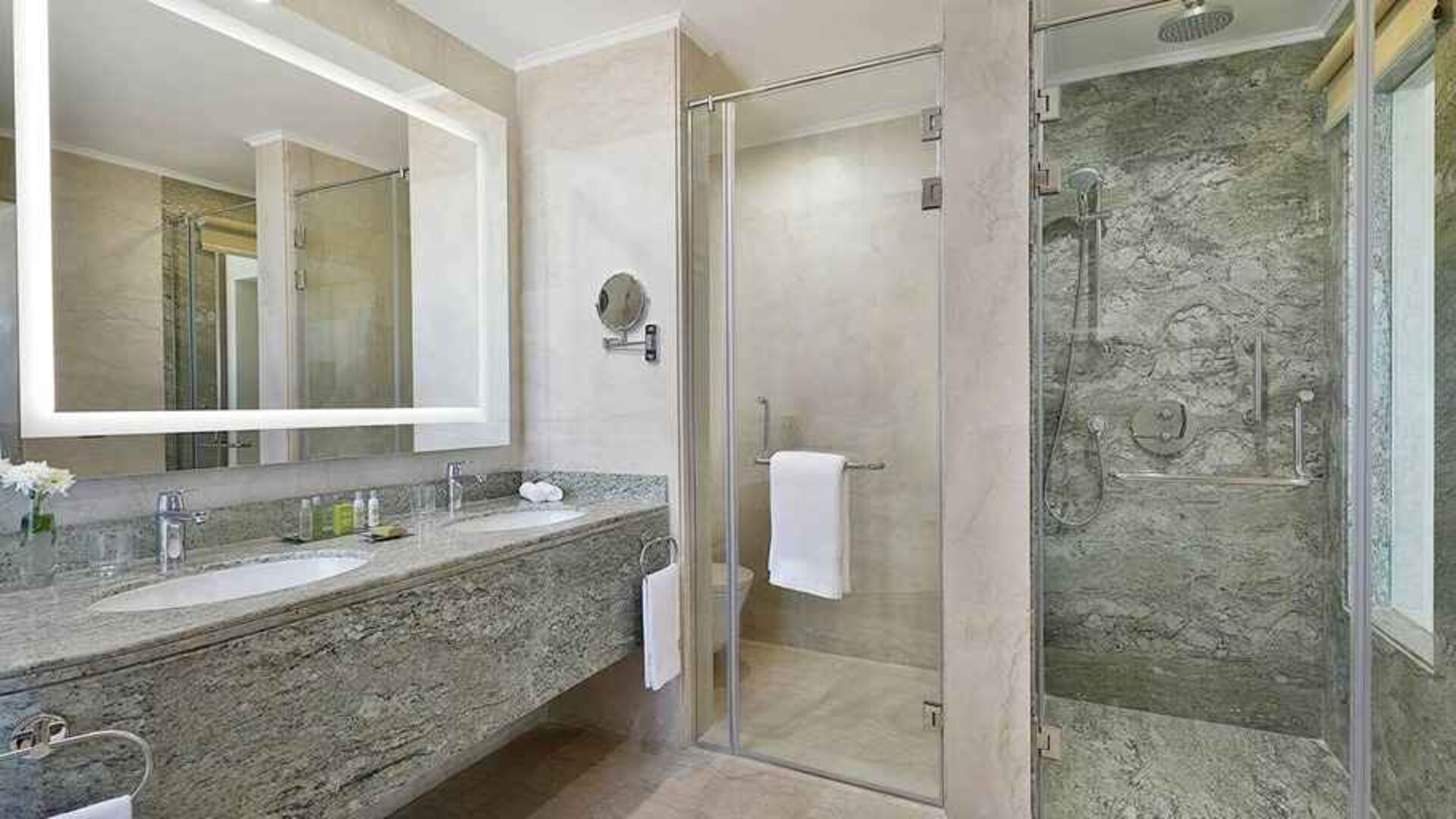 clean and spacious king bathroom with shower at Hilton Hurghada Plaza.