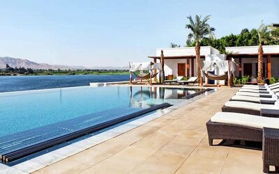 stunning outdoor pool with sunbeds at Hilton Luxor Resort & Spa.