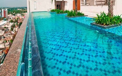 stunning outdoor pool with city views at Hilton Chennai.