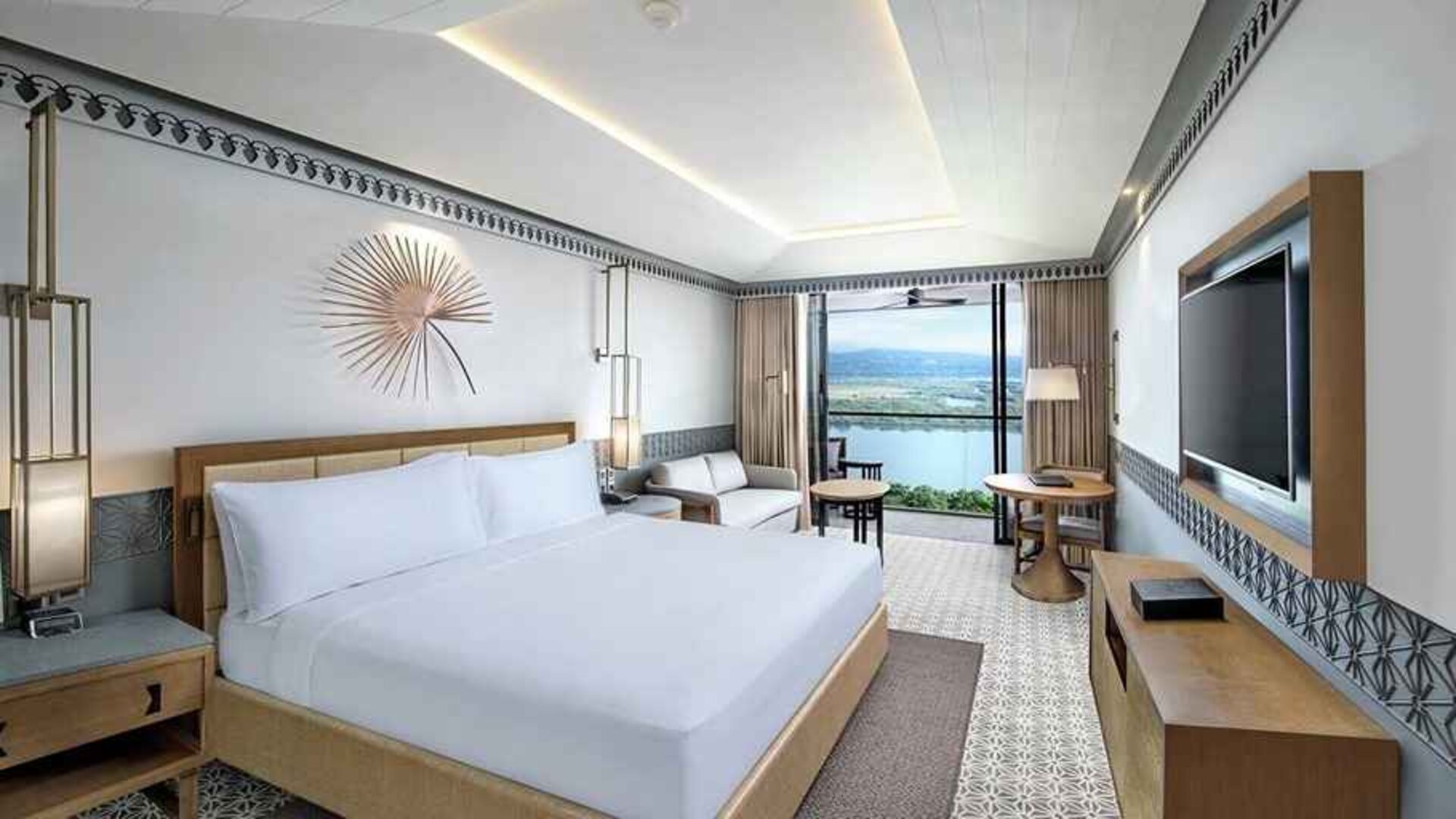 lovely delux king with TV, work desk, and couch at DoubleTree by Hilton Goa - Panaji.