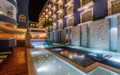 Pool by night at the Villa Mercedes Merida, Curio Collection by Hilton.