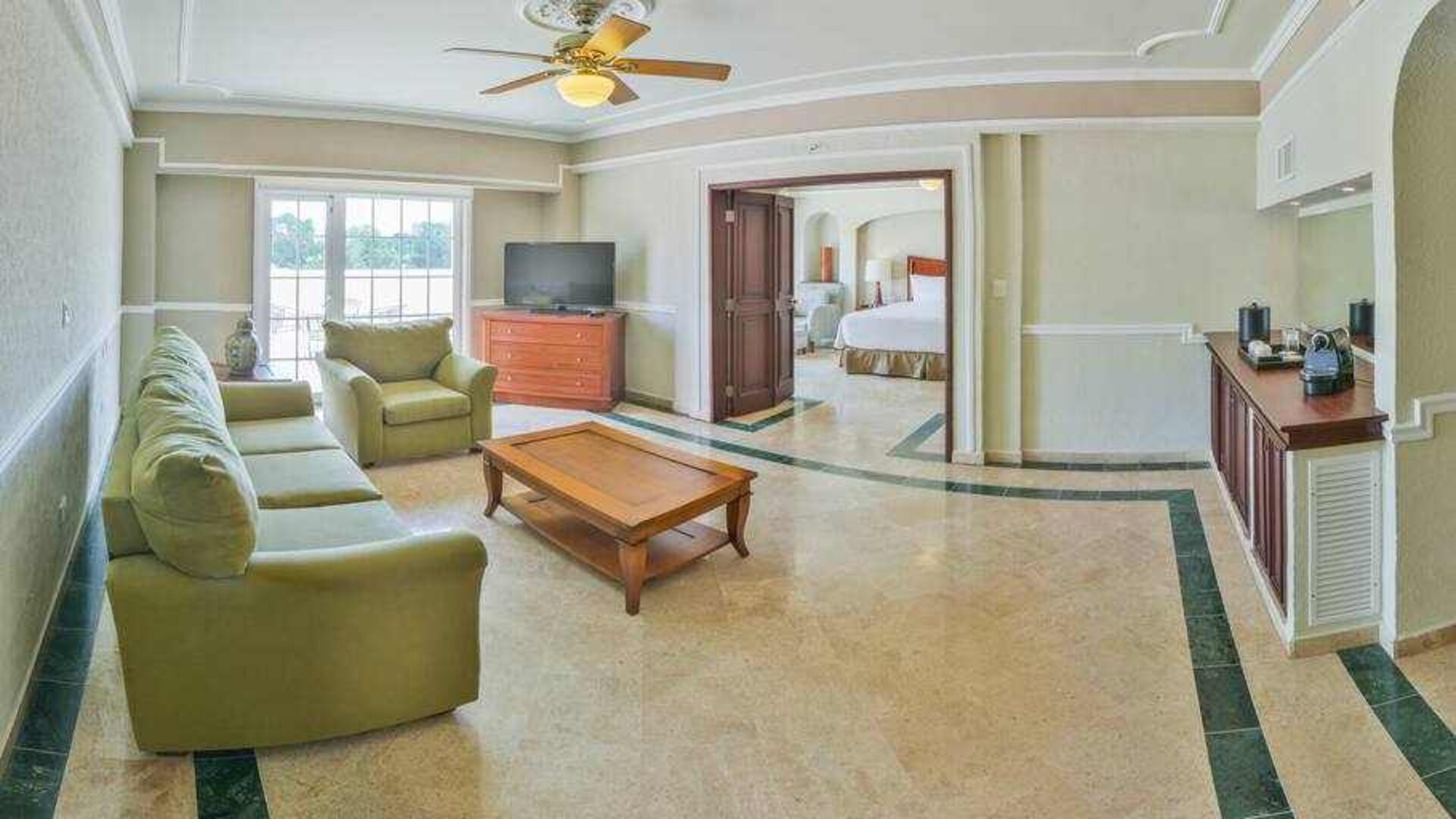 Living room in a hotel suite at the Villa Mercedes Merida, Curio Collection by Hilton.