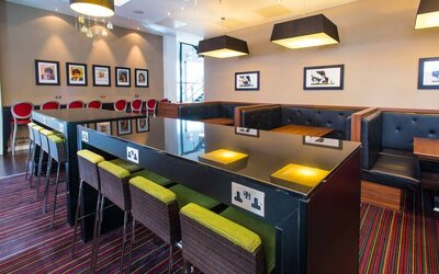 Coworking space with places to charge laptops and other devices. 