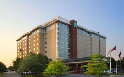 Exterior view of Embassy Suites By Hilton Charleston Airport Convention Center showcasing its modern architecture, landscaped grounds, and convenient entrance.