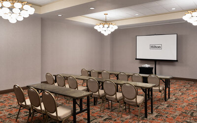 Flexible event and meeting room equipped for presentations, training sessions, and business gatherings at Embassy Suites By Hilton Charleston Airport Convention Center.