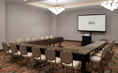 Meeting room configured in a U-shape layout, suitable for training sessions, workshops, and business meetings at Embassy Suites By Hilton Charleston Airport Convention Center.