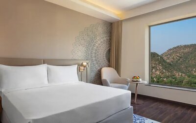 Hotel room with large window at the DoubleTree by Hilton Jaipur Amer.