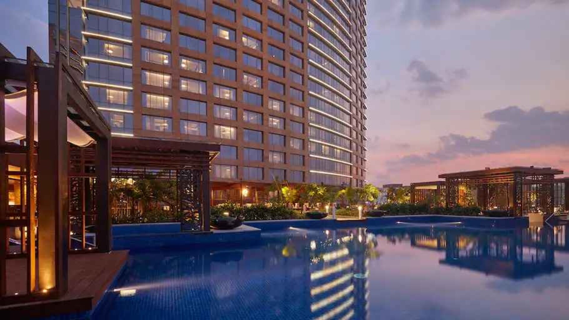 Relaxing outdoor pool at the Conrad Bengaluru.