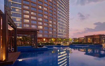Relaxing outdoor pool at the Conrad Bengaluru.