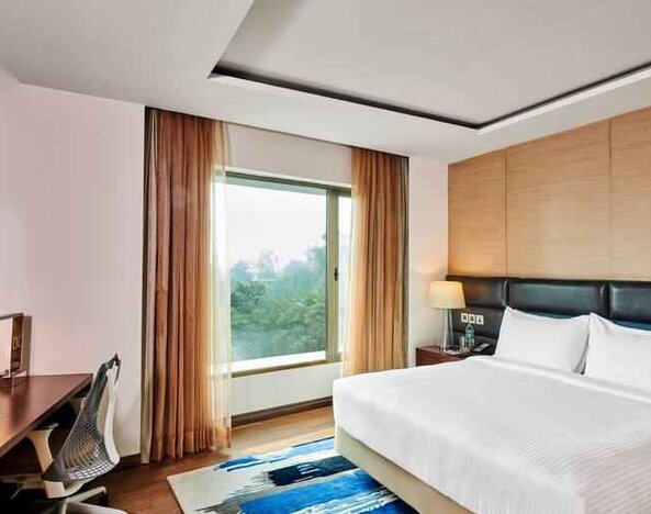 King bedroom with desk at the Hilton Garden Inn Lucknow.