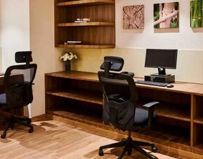 Business center with computers at the Hilton Garden Inn Lucknow.